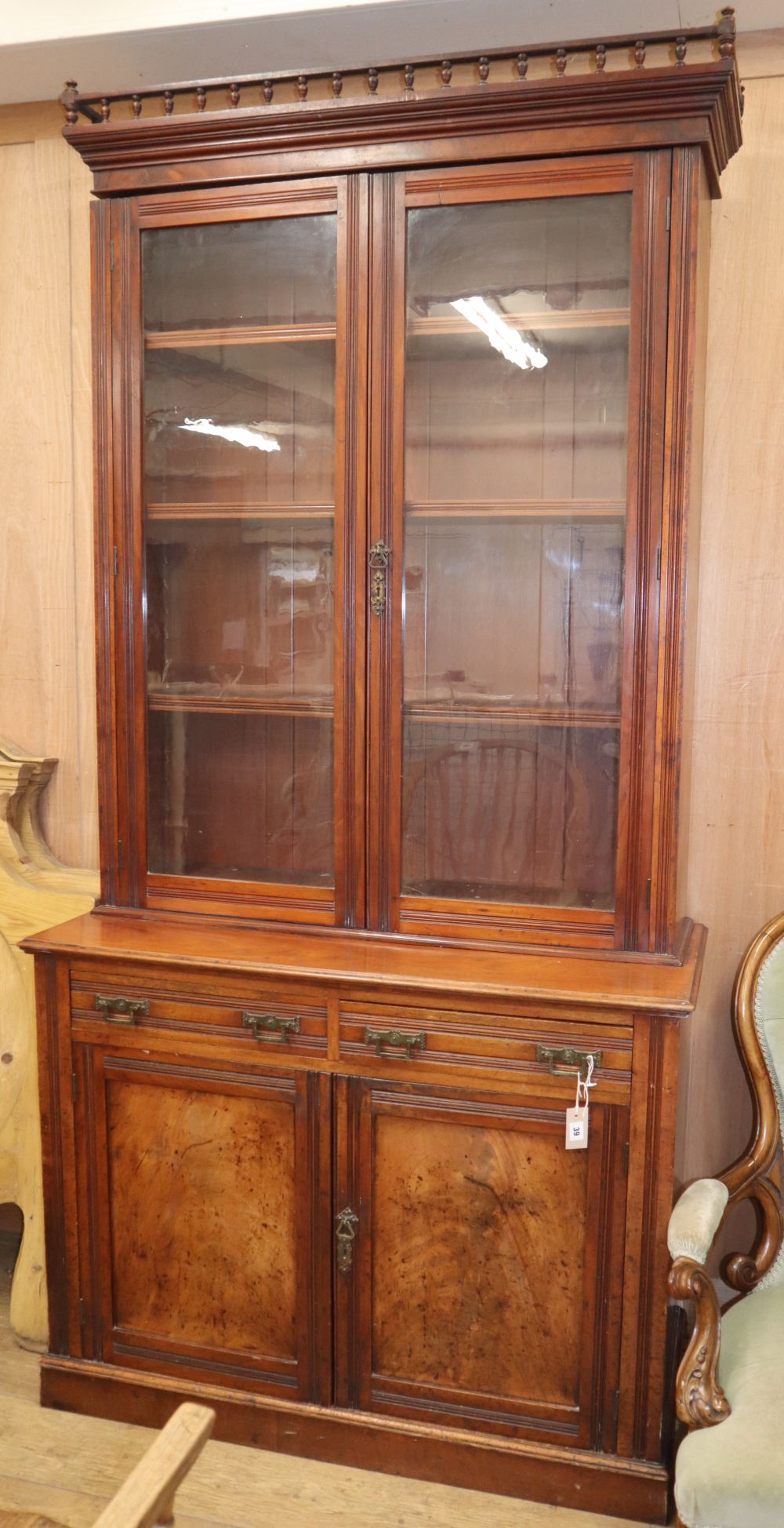 A late Victorian mahogany bookcase cupboard, W.118cm D.50cm H.240cm